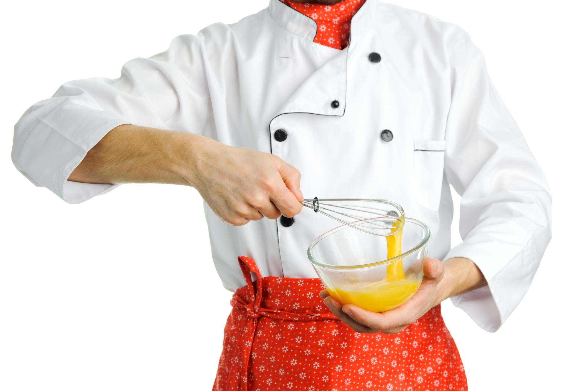 Instructor guiding pastry technique